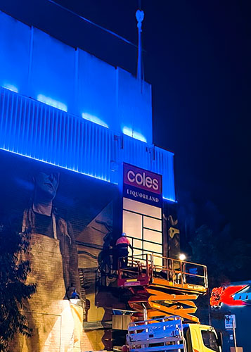 Coles Install Building Sign at night